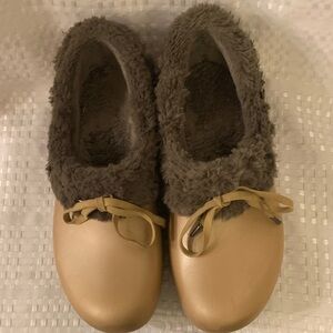 CROCS  gold with brown faux fur lining and trim, women’s size 9.